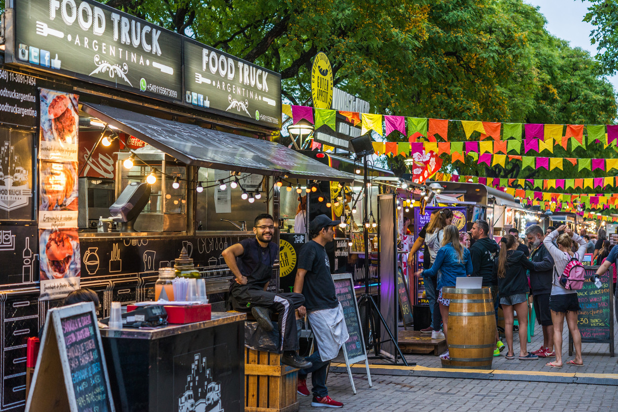 Festival food court showing happy vendors and festival goers