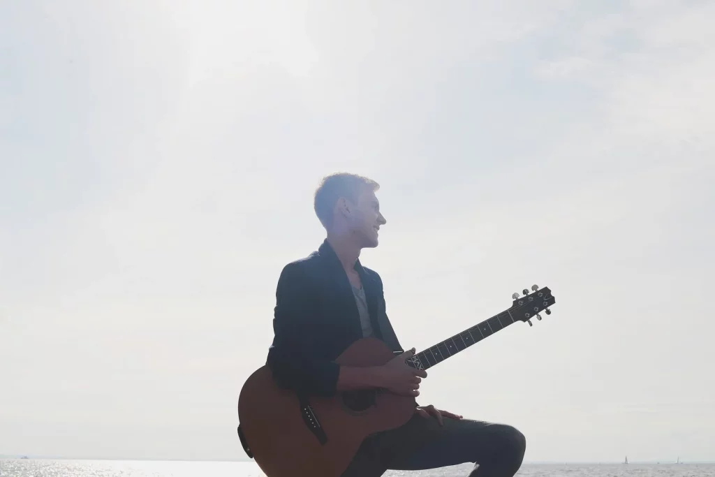Maxim Yarushkin with his guitar.
